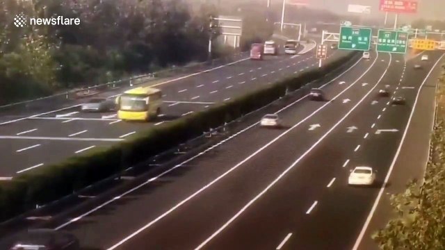 Transport truck flips over trying to avoid stalled car on Chinese highway