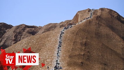 Tourists line up to scale Australia's Uluru hours ahead of climb ban