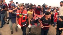 Dozens of demonstrators injured in clashes with Israeli soldiers at Gaza border