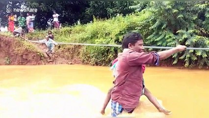 Children risk lives to cross flooded river just to get to school