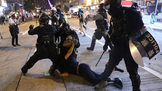 Illegal rally turns violent on 21st weekend of anti-government protests in Hong Kong