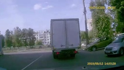 Truck Tries to Squeeze Under Bridge