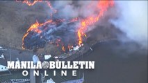 Aerial footage shows fire raging near highways, marina in California