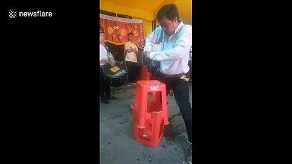 Man uses electric drill to pierce his nose at show in Vietnam