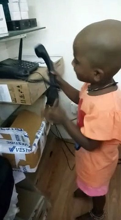 kid playing with phone