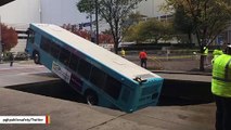 Dramatic Photo Shows Bus Partly Swallowed By Sinkhole