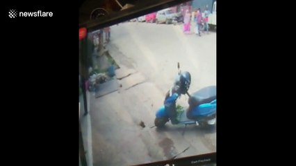 Heart-stopping moment little girl gets up and walks away after falling from moving car in India