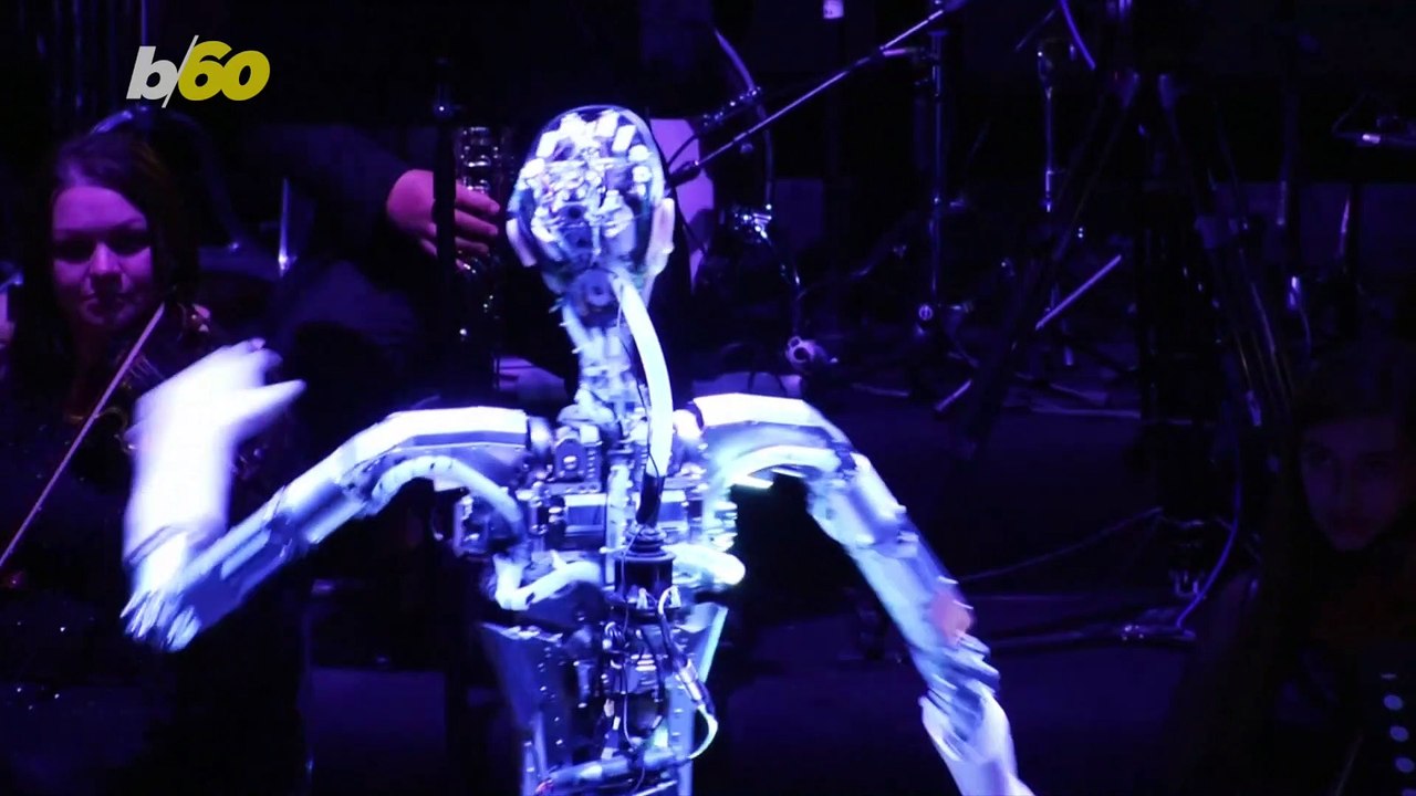 Heavy Metal! Robot Conducts Human Orchestra Through Live Performance
