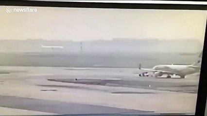 Plane crushes tow truck when being dragged to gate at Thai airport, killing one