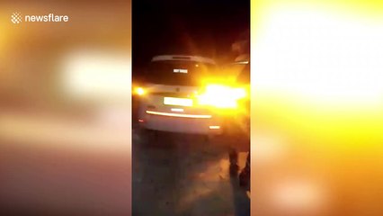 Snowbound travellers team up with police to dig free cars trapped in north Indian blizzard