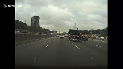 Dashcam footage shows moment tree crashes onto highway as storms rip through Atlanta