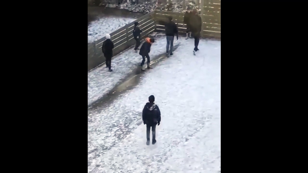 Kid Tries To Slide On Ice And Falls