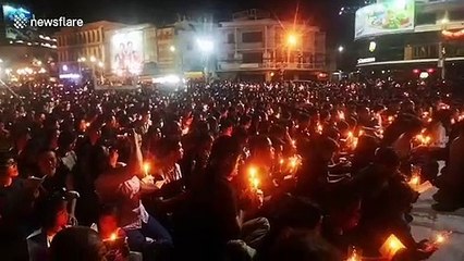 Download Video: Thousands of grieving Thais hold candlelight vigil for mass shooting victims