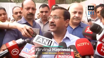 Delhi CM Kejriwal distributes masks to school children