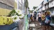Olor a pintura y flores inunda los cementerios filipinos en el Día de Muertos
