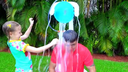 Stacy and Dad play outside with water toys.
