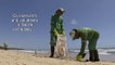 Volunteers and civil servants clean oil spill from Brazilian beach