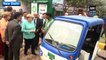 German Chancellor Angela Merkel meets electric-rickshaw operators in Delhi