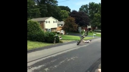 Dirt Biker Does A Wheelie And Falls On His Back