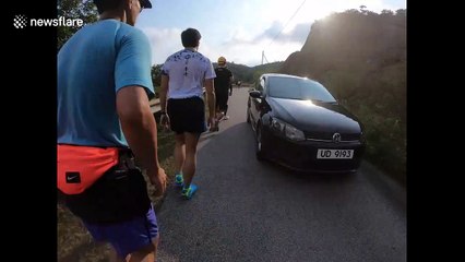 Hong Kong half marathon runner dresses up in protester gear