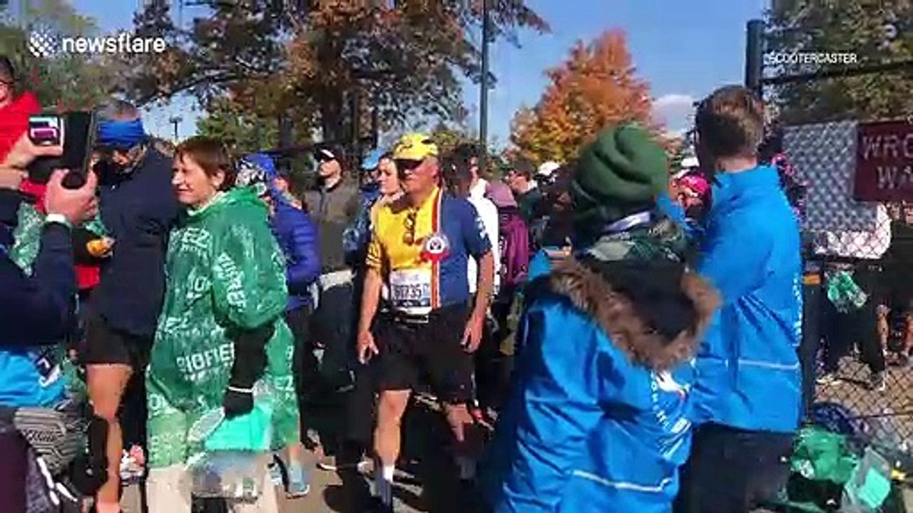 Runners and volunteers prepare for the start of the New York marathon