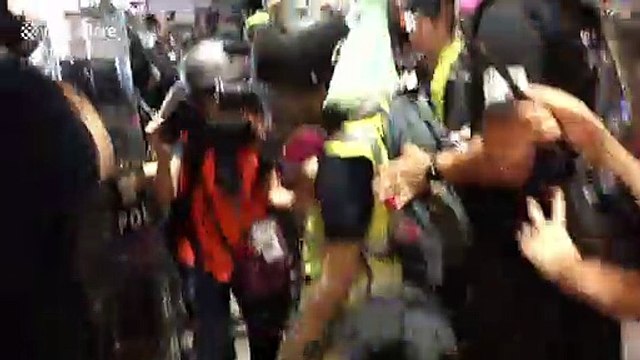 Journalists charged and pepper-sprayed by Hong Kong riot police