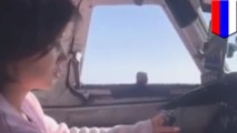 Russian pilot lets female passenger fly the plane