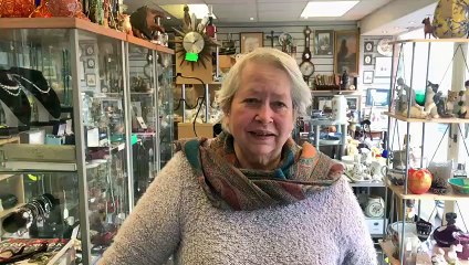 Car smashes shop window