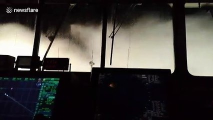 Waves smash violently against windows of cargo ship in North Atlantic