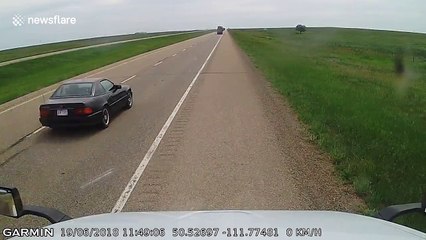 Dashcam captures moment flying mudflap strikes car on Trans-Canada Highway