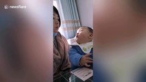 Chinese mother stops chewing when her son looks at her to avoid being caught eating
