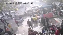 Passersby help paramedics tend to woman giving birth outside hospital gates in China