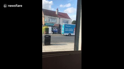 Hermes delivery driver seen throwing packages carelessly into back of van in London