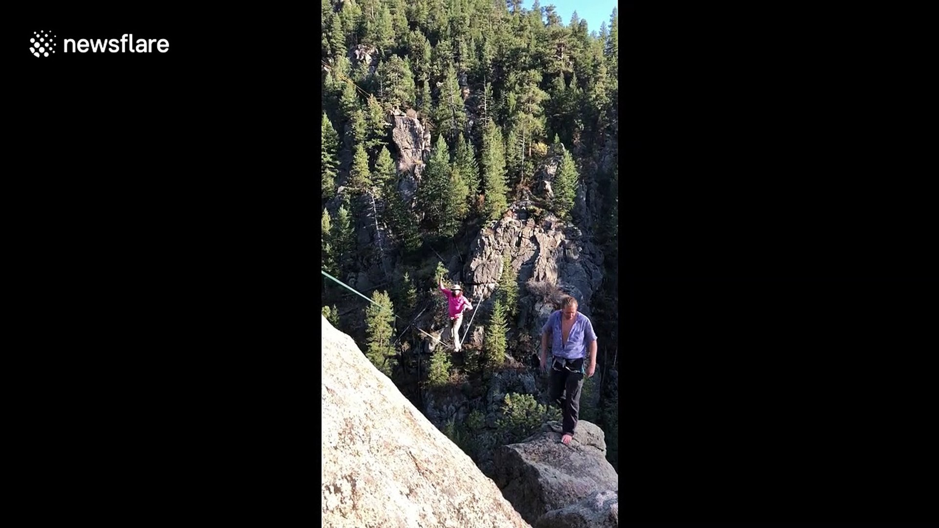Legendary man shotguns a beer while on a tight rope over Rocky Mountains