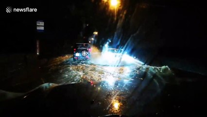 Car in Yorkshire slogs through heavily flooded road