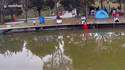 Heroic Chinese fisherman rescues toddler who jumped into pond 'for fun'