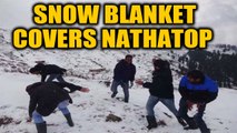 Tourists enjoy early snowfall in Nathatop, J&K | OneIndia News