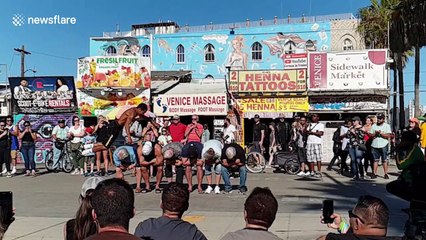 Performer on LA's Venice Beach flips over not one but SIX men