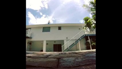 Kid Jumps From A Roof Top Into A Pool