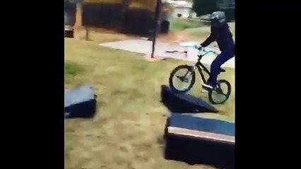 Kid On A Bike Jumps A Ramp And Fails