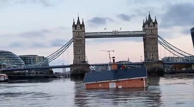 Extinction Rebellion floats British house mock-up sinking in Thames in climate protest