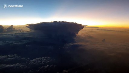 Pilot captures the spectacular moment the sun rises over a thunderstorm 41,000 feet in the air over Persian Gulf