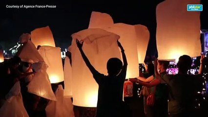 Sky glitters as lanterns released at Thai festival