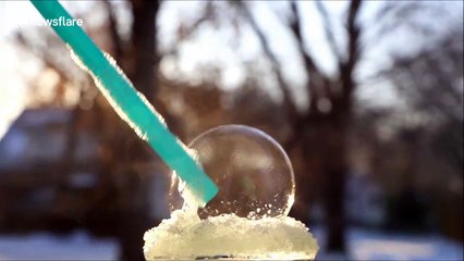 Frosty weather in Canada freezes soap bubble solid in mesmerising video