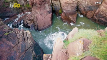 Watch This Daredevil Backflip Off a Cliff, Narrowly Avoiding the Rocks Below