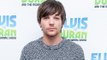 Louis Tomlinson brands One Direction's hits 'vague'