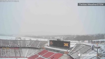 Snow falls above Iowa State's Jack Trice Stadium