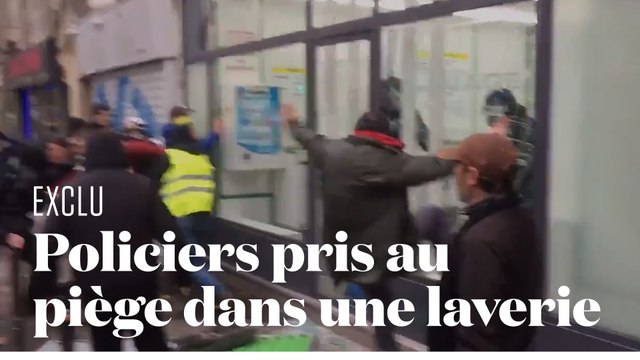 Deux policiers pris au piège dans une laverie face à des manifestants violents