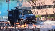Hong Kong police use water cannons as clashes rage at university