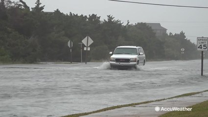Powerful surf inundates highway